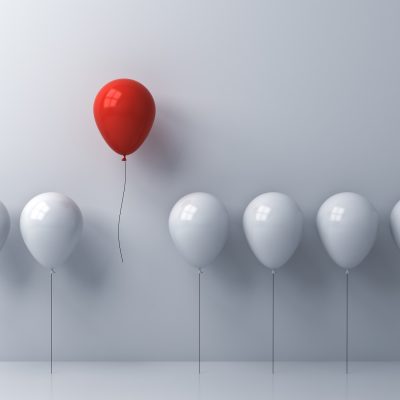 Stand out from the crowd and different concept , One red balloon flying away from other white balloons on white wall background with window reflections and shadows . 3D rendering Stand out from the crowd and different concept , One red balloon flying away from other white balloons on white wall background with window reflections and shadows . 3D rendering.